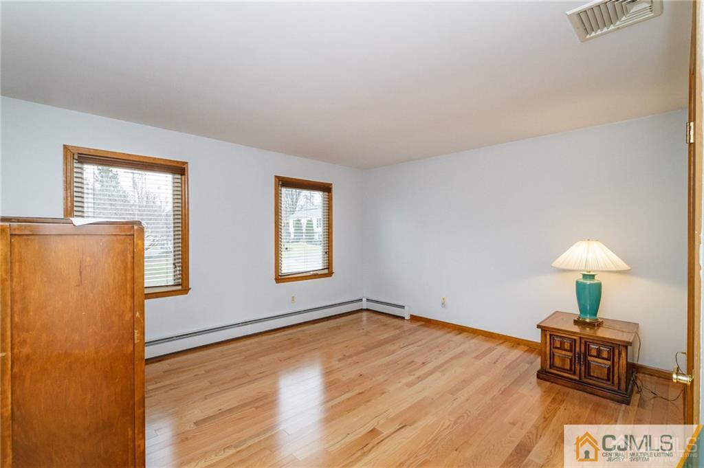 17 Garden Street East Hanover, NJ 07936 - Photo 17 of 34 a view of a livingroom with wooden floor and a table