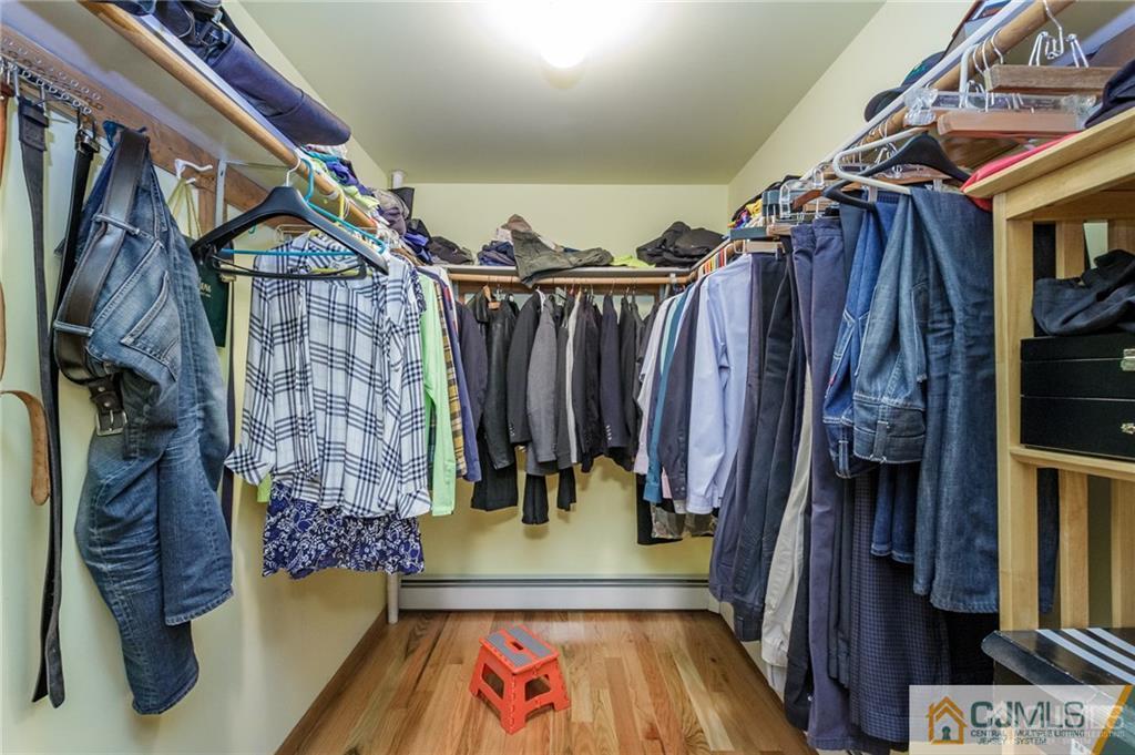 17 Garden Street East Hanover, NJ 07936 - Photo 22 of 34 a view of walk in closet with clothes and shoes