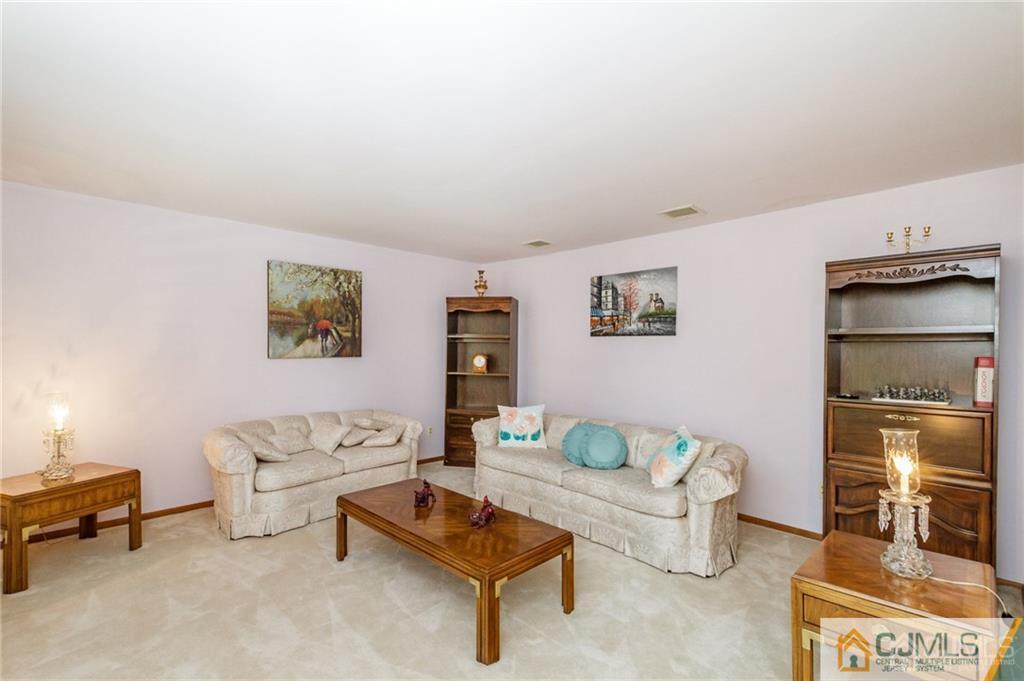 17 Garden Street East Hanover, NJ 07936 - Photo 4 of 34 a living room with furniture and a table