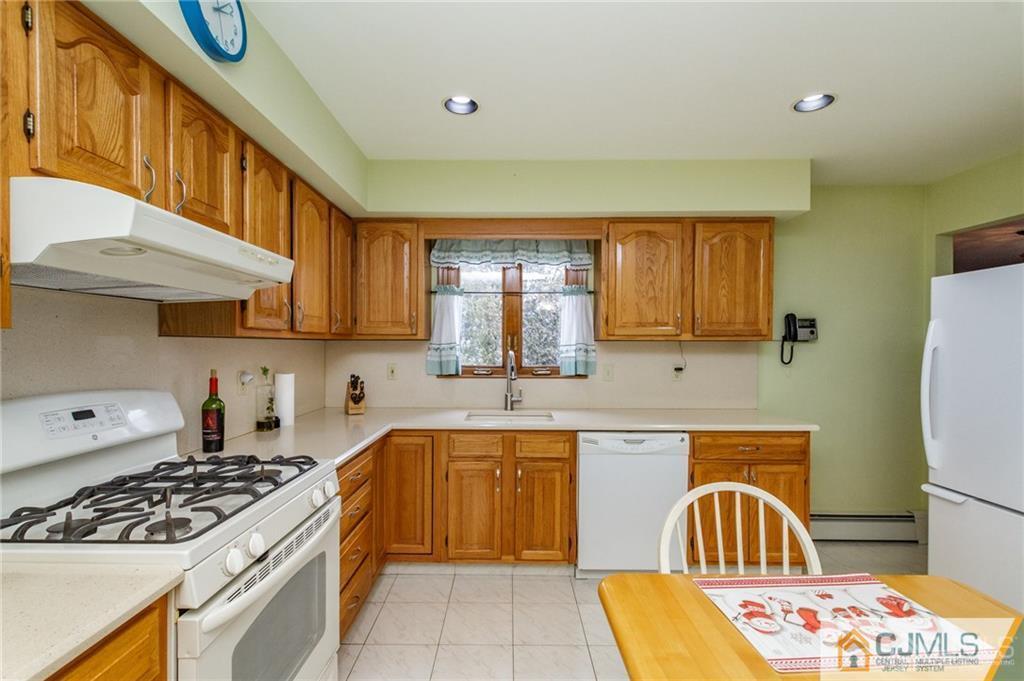 17 Garden Street East Hanover, NJ 07936 - Photo 9 of 34 a kitchen with a stove a sink and a refrigerator