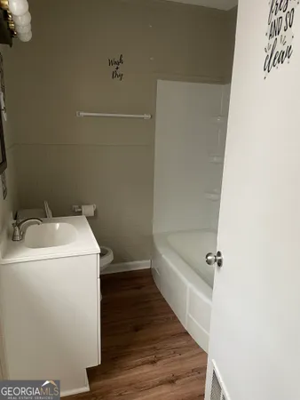 a bathroom with a sink and vanity