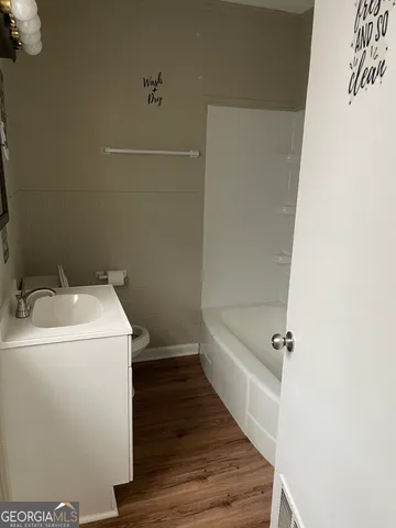 a bathroom with a sink and vanity