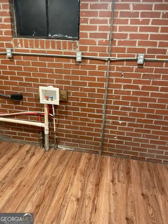 a view of outdoor space with wooden floor