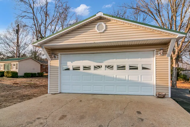 a front view of a house with garage