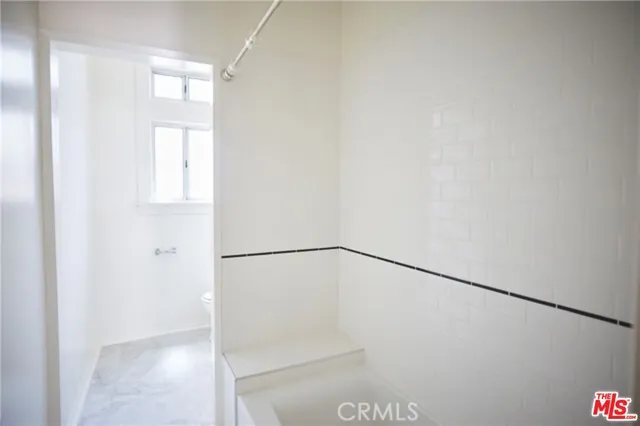 a view of small space with racks on the wall