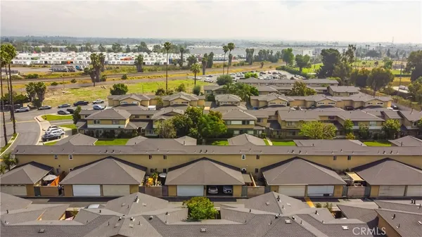 a view of a swimming pool with outdoor seating and plants