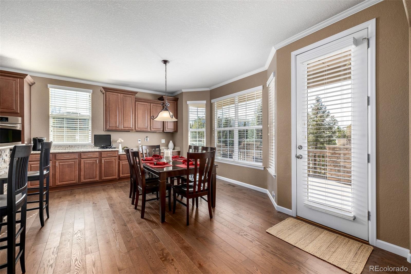 3422 Vestal Loop Broomfield, CO 80023 - Photo 17 of 50 a view of a dining room with furniture and windows