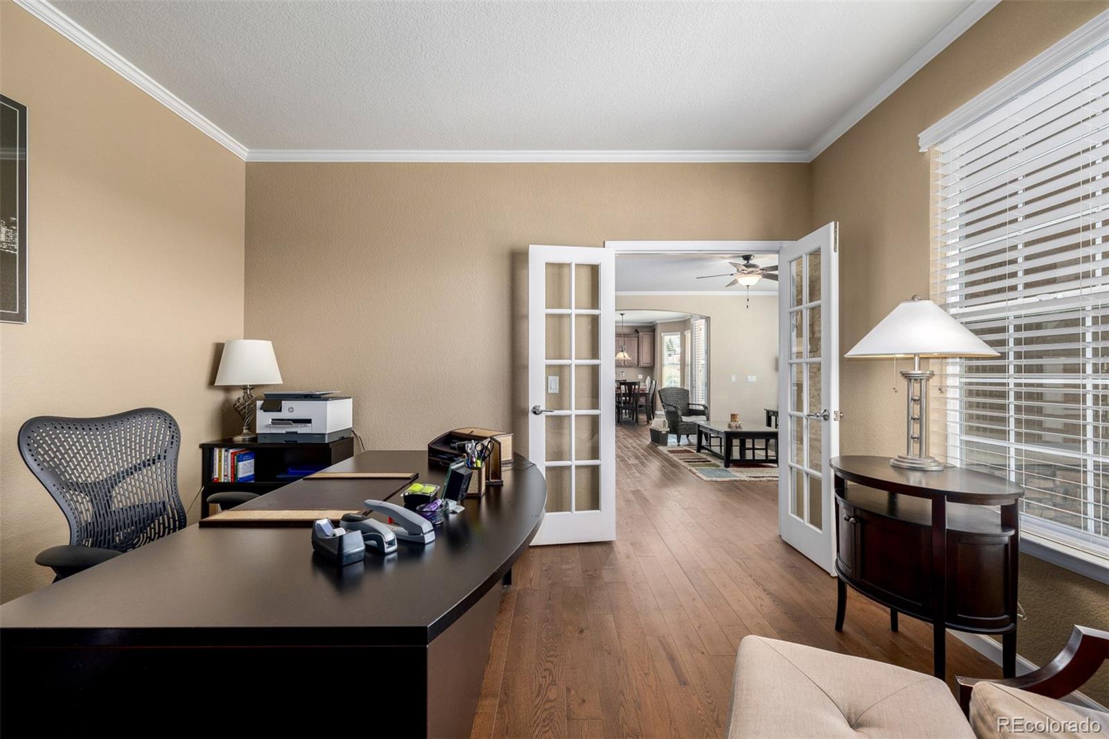 3422 Vestal Loop Broomfield, CO 80023 - Photo 18 of 50 a living room with furniture and a wooden floor