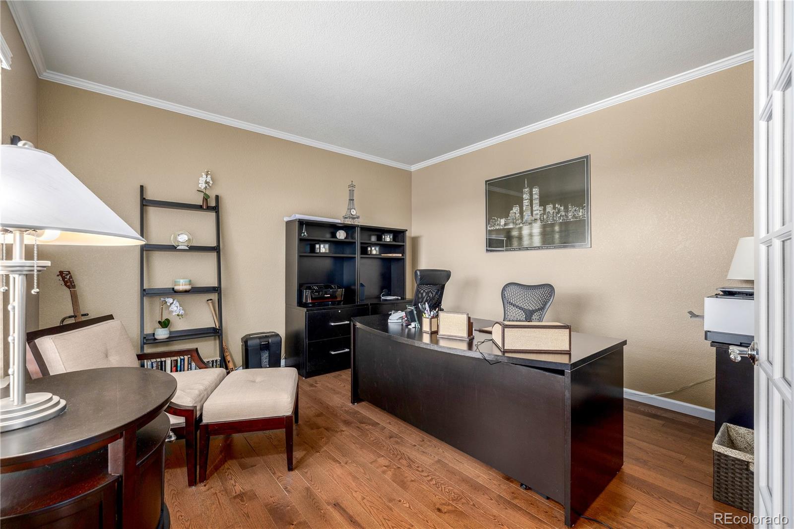 3422 Vestal Loop Broomfield, CO 80023 - Photo 19 of 50 a living room with furniture and a flat screen tv