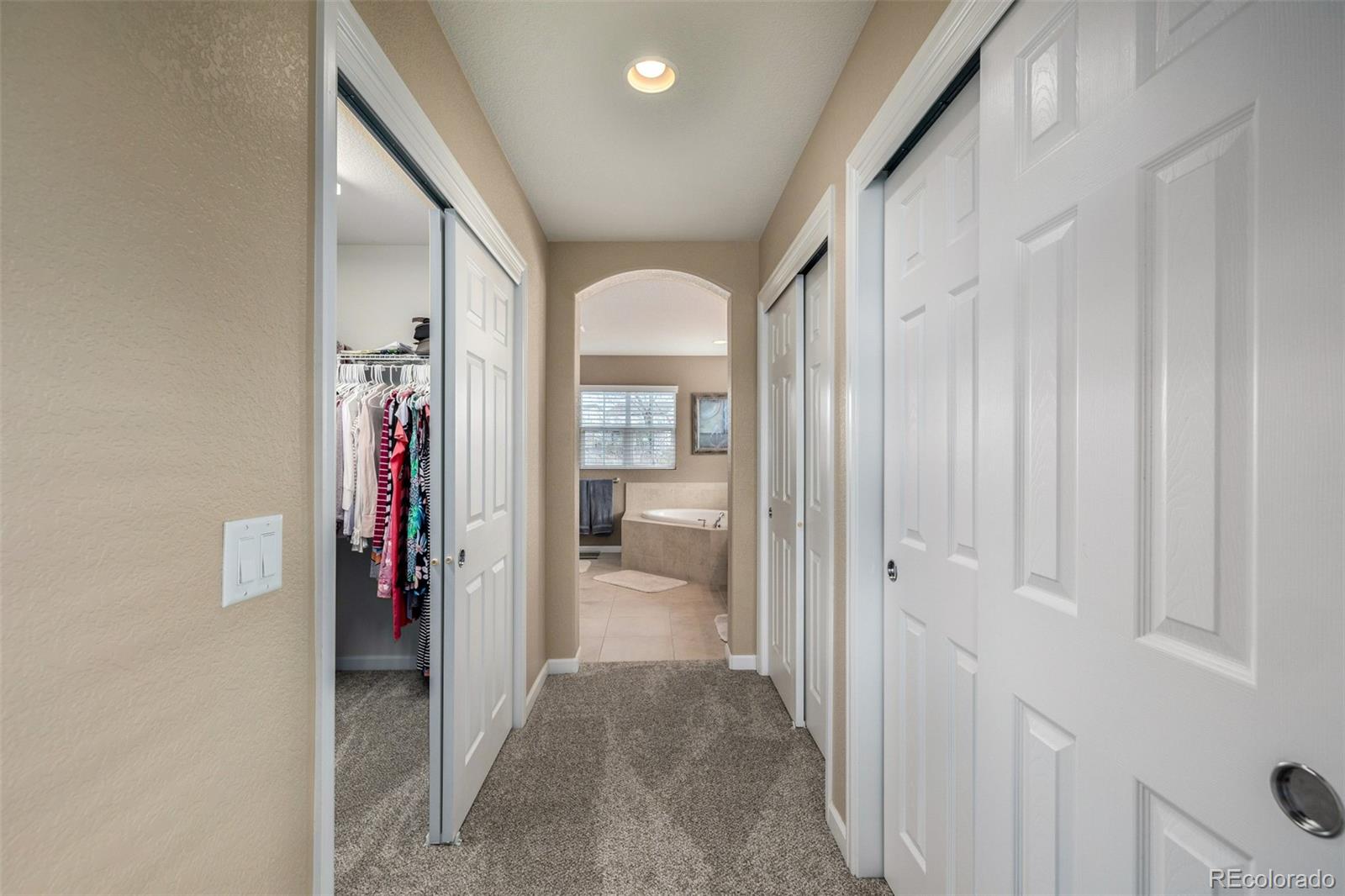 3422 Vestal Loop Broomfield, CO 80023 - Photo 23 of 50 a view of a hallway with toilet and bathroom