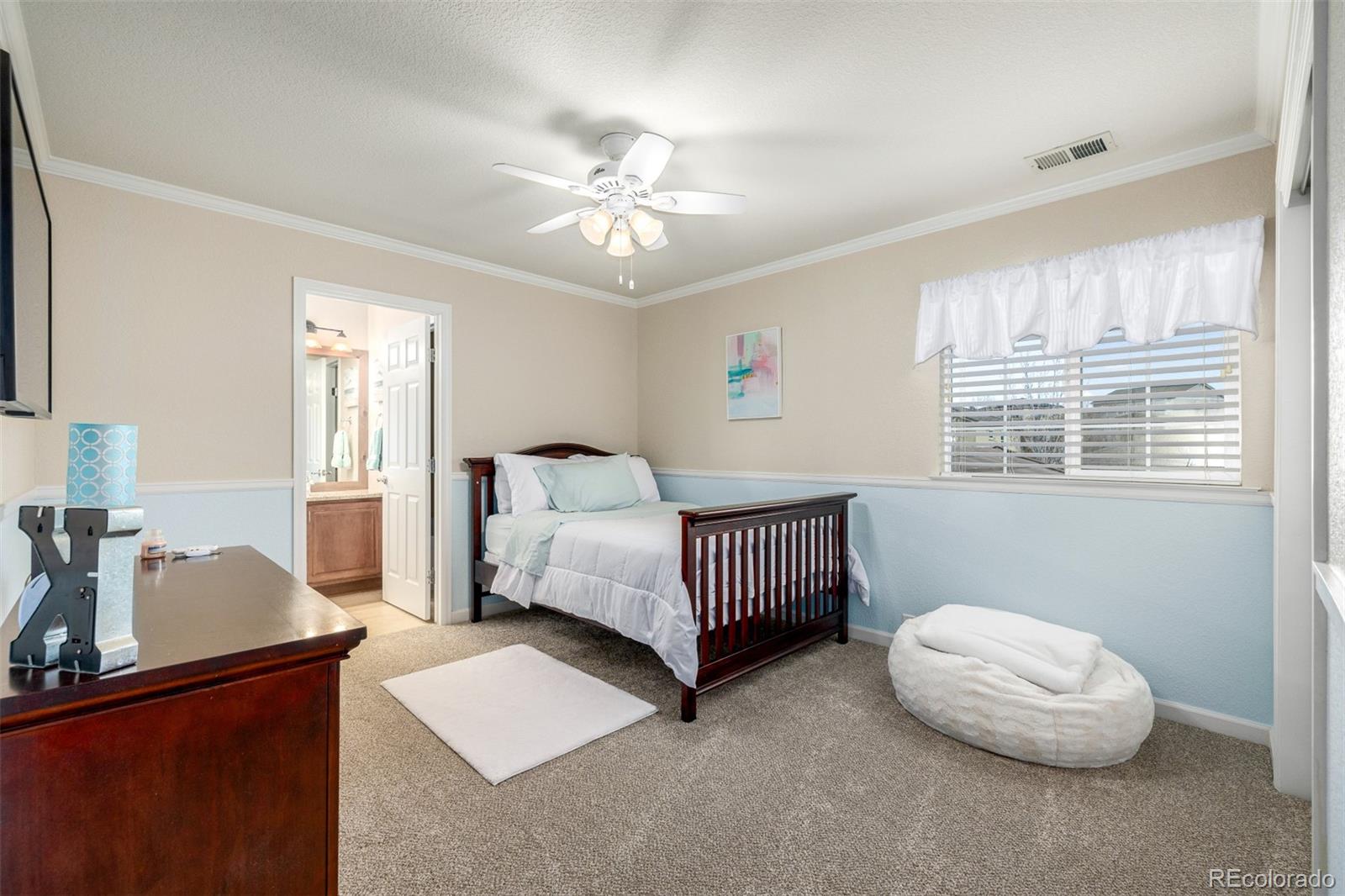 3422 Vestal Loop Broomfield, CO 80023 - Photo 31 of 50 a bedroom with a bed and a window