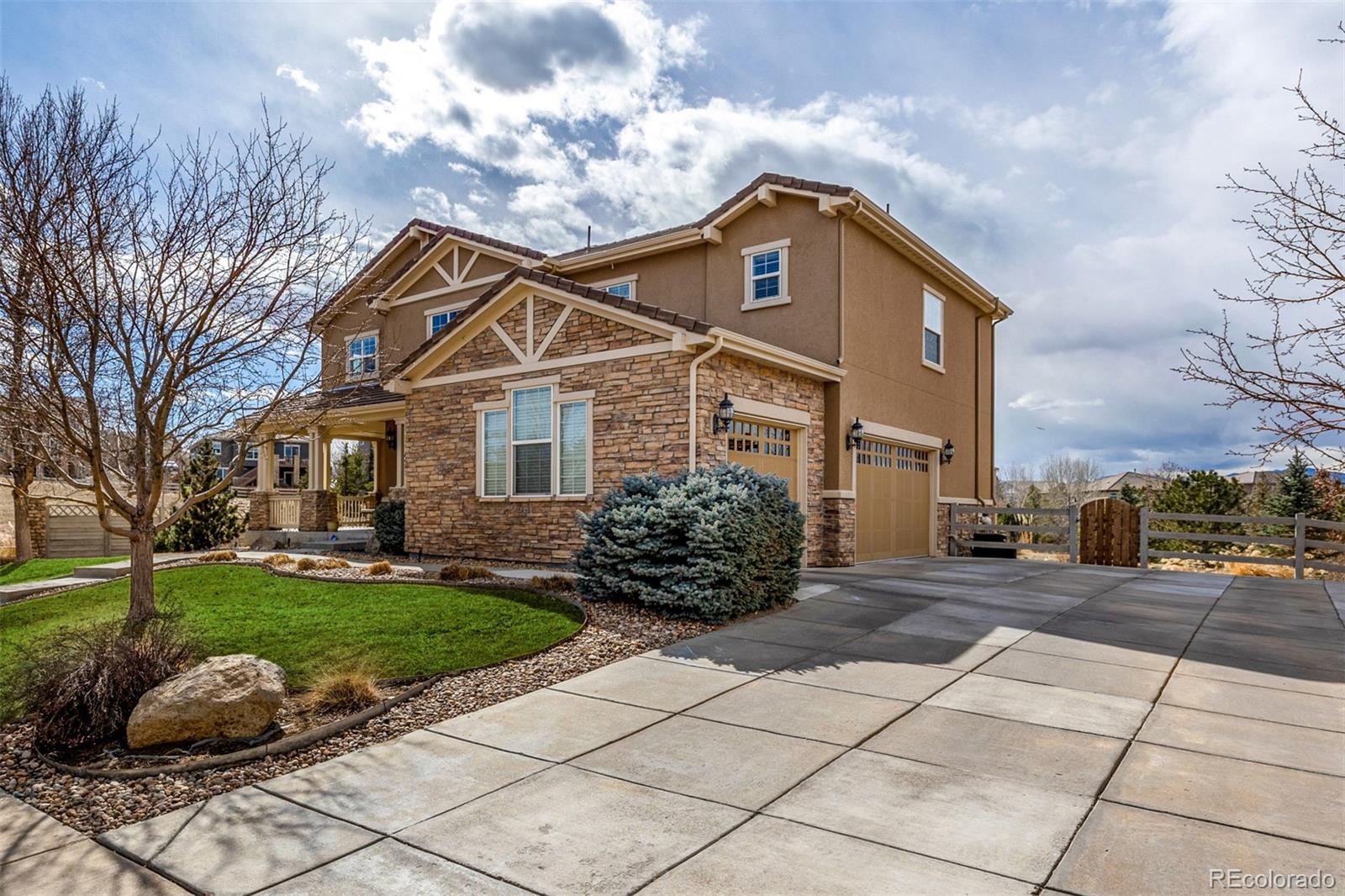 3422 Vestal Loop Broomfield, CO 80023 - Photo 4 of 50 a front view of a house with garden