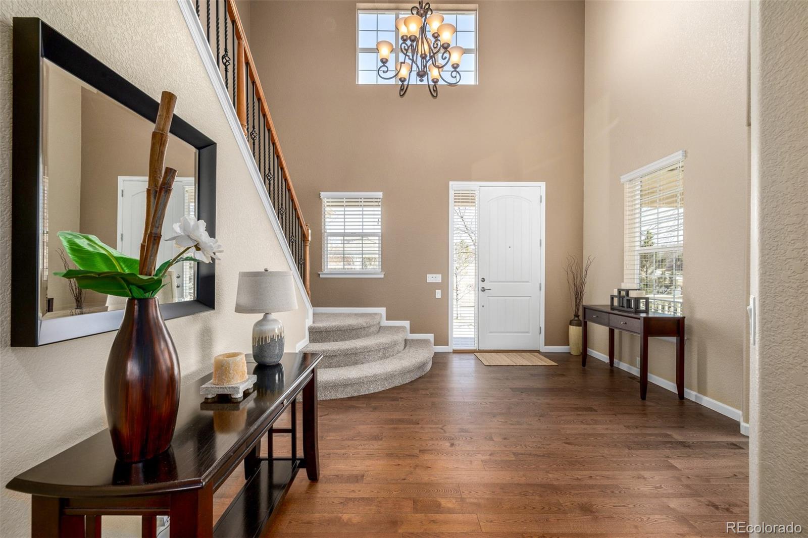 3422 Vestal Loop Broomfield, CO 80023 - Photo 6 of 50 a view of a livingroom with furniture window and wooden floor