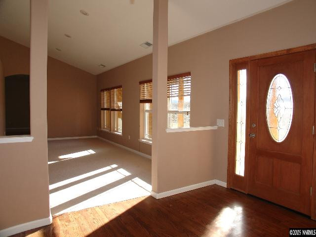 3055 Antelope Valley Road Reno, NV 89506 - Photo 7 of 9 a view of an empty room with wooden floor and a window