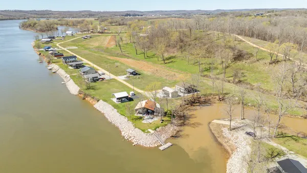a view of a lake with a yard