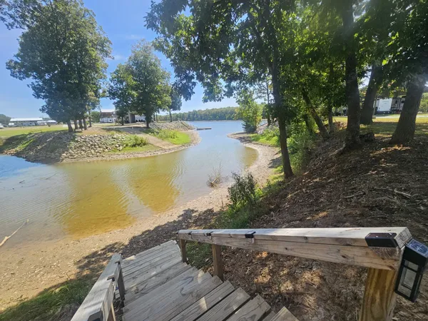 a view of a lake with a yard