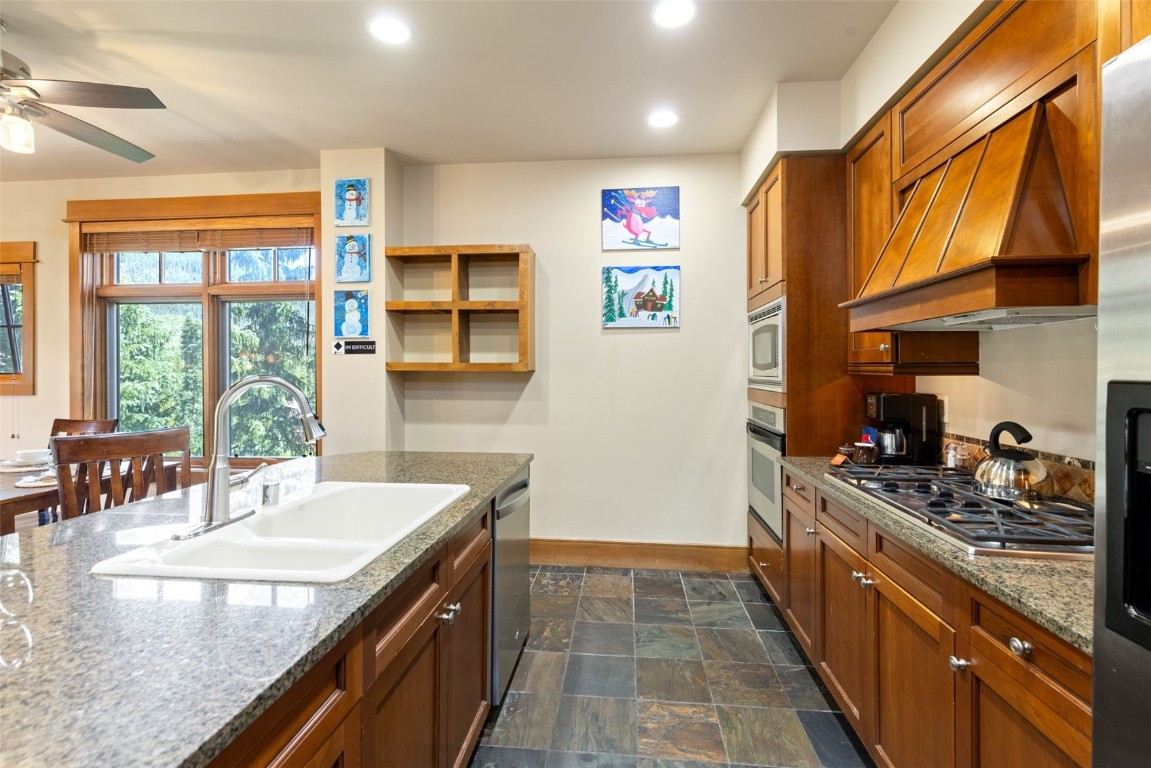 280 Trailhead Drive, Unit 3027 Keystone, CO 80435 - Photo 18 of 50 a kitchen with stainless steel appliances granite countertop a sink and a stove