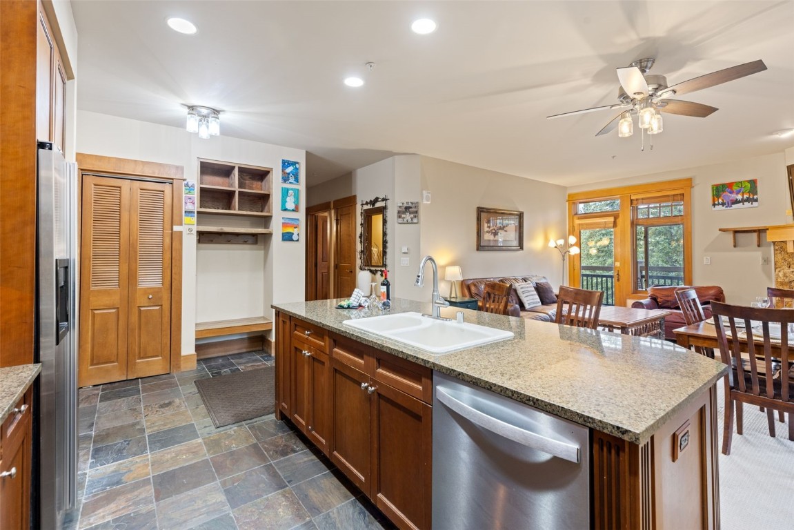 280 Trailhead Drive, Unit 3027 Keystone, CO 80435 - Photo 20 of 50 a large kitchen with kitchen island a sink stainless steel appliances and cabinets