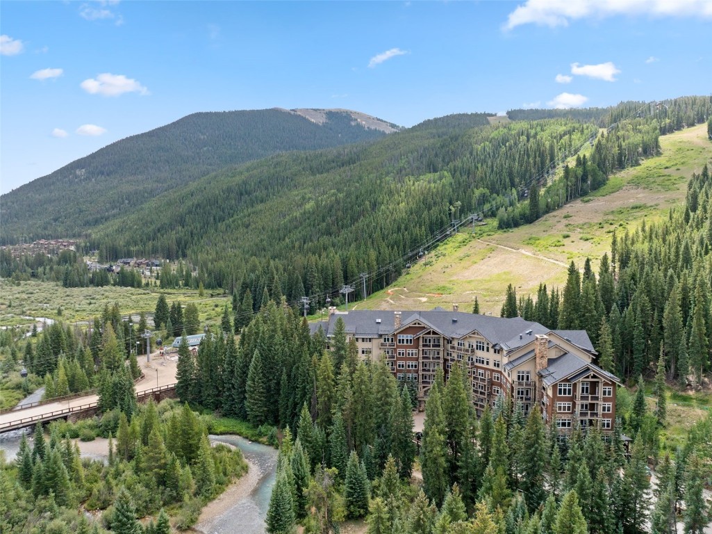 280 Trailhead Drive, Unit 3027 Keystone, CO 80435 - Photo 22 of 50 a view of a lake with a mountain