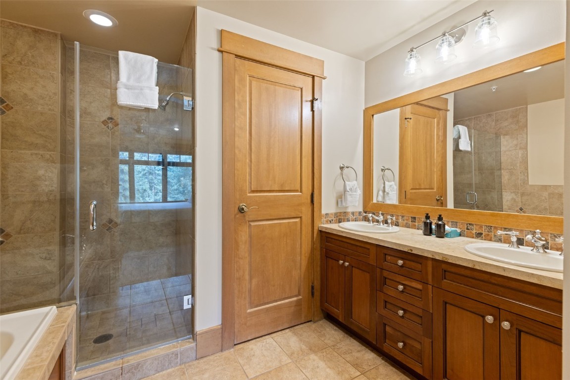 280 Trailhead Drive, Unit 3027 Keystone, CO 80435 - Photo 29 of 50 a bathroom with a double vanity sink mirror and shower