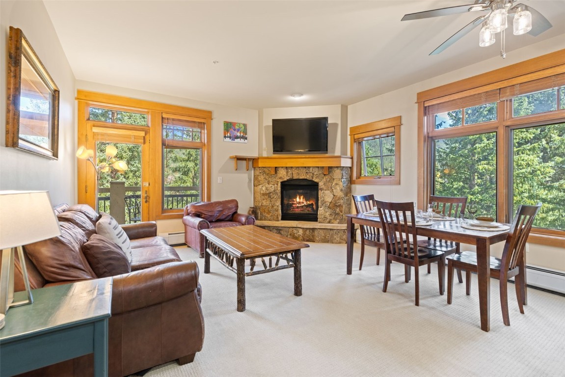 280 Trailhead Drive, Unit 3027 Keystone, CO 80435 - Photo 3 of 50 a living room with furniture a fireplace and a large window