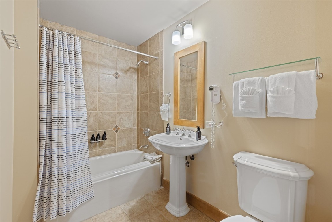 280 Trailhead Drive, Unit 3027 Keystone, CO 80435 - Photo 34 of 50 a bathroom with a sink toilet and shower