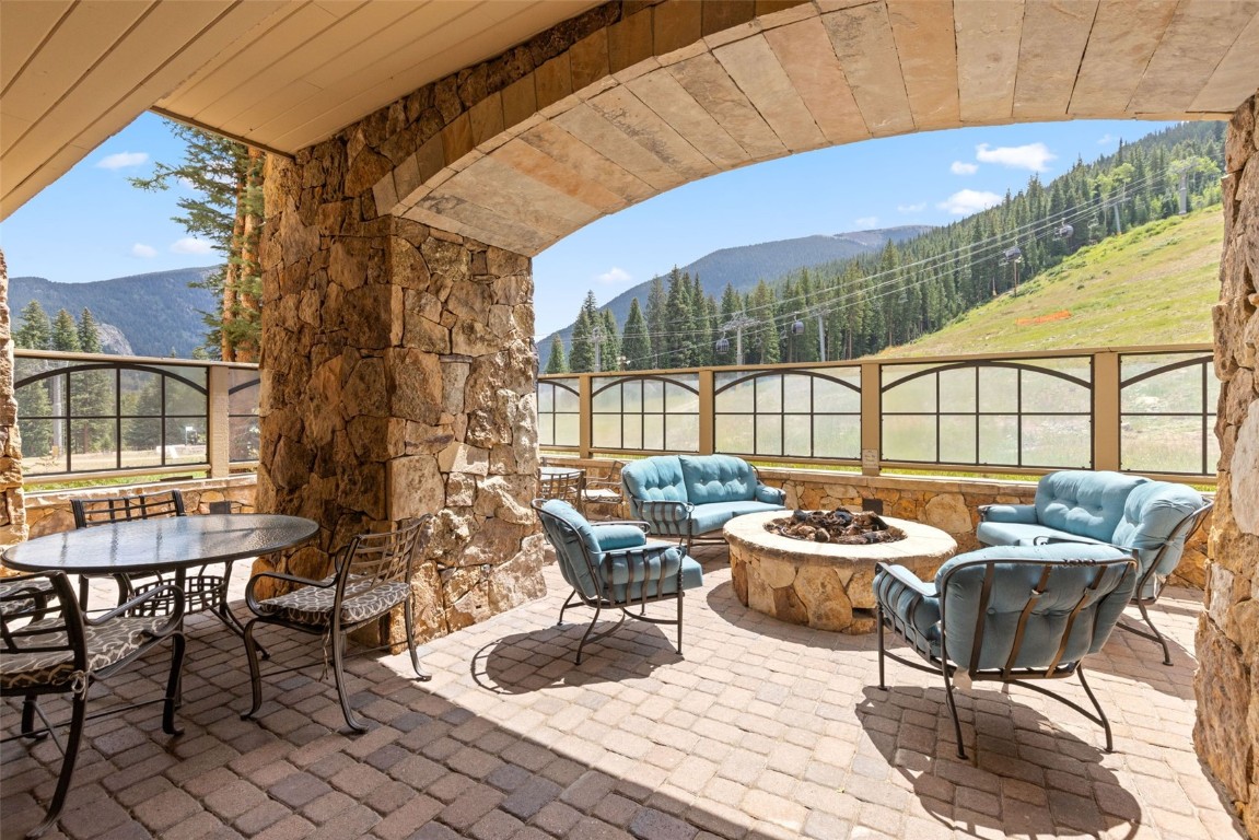 280 Trailhead Drive, Unit 3027 Keystone, CO 80435 - Photo 36 of 50 View of patio / terrace with an outdoor living space with a fire pit and a mountain view
