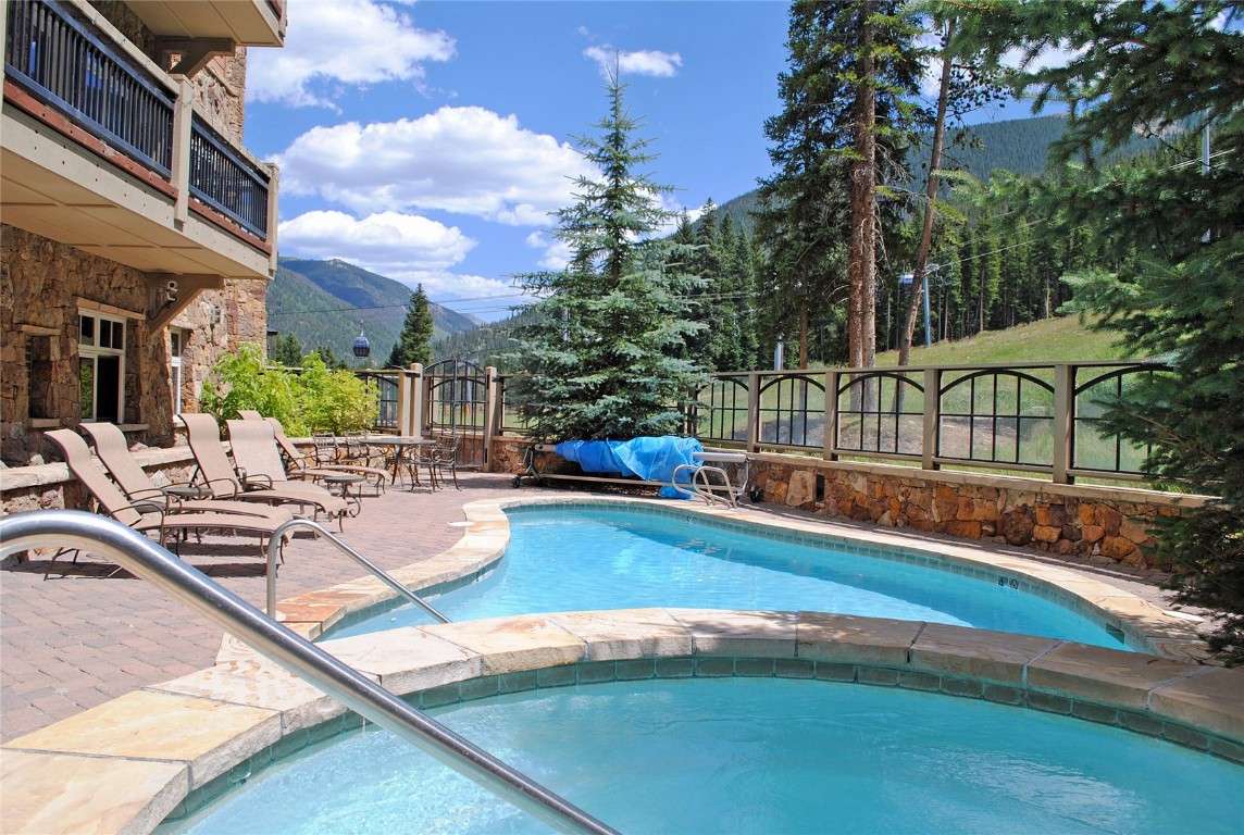 280 Trailhead Drive, Unit 3027 Keystone, CO 80435 - Photo 4 of 50 a view of a swimming pool with sitting area