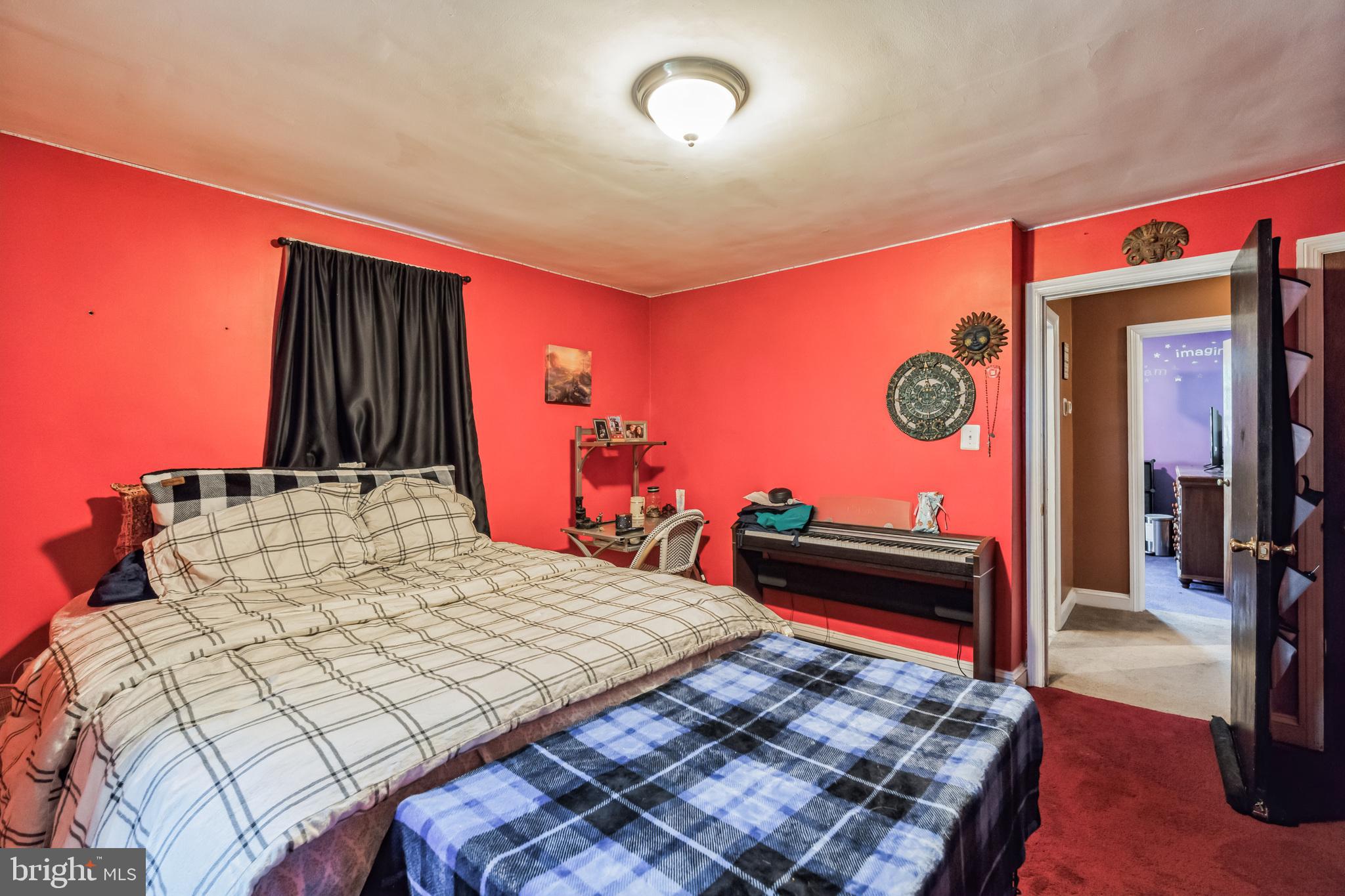 1443 Rhawn Street Philadelphia, PA 19111 - Photo 22 of 45 a bed room with a bed and a television