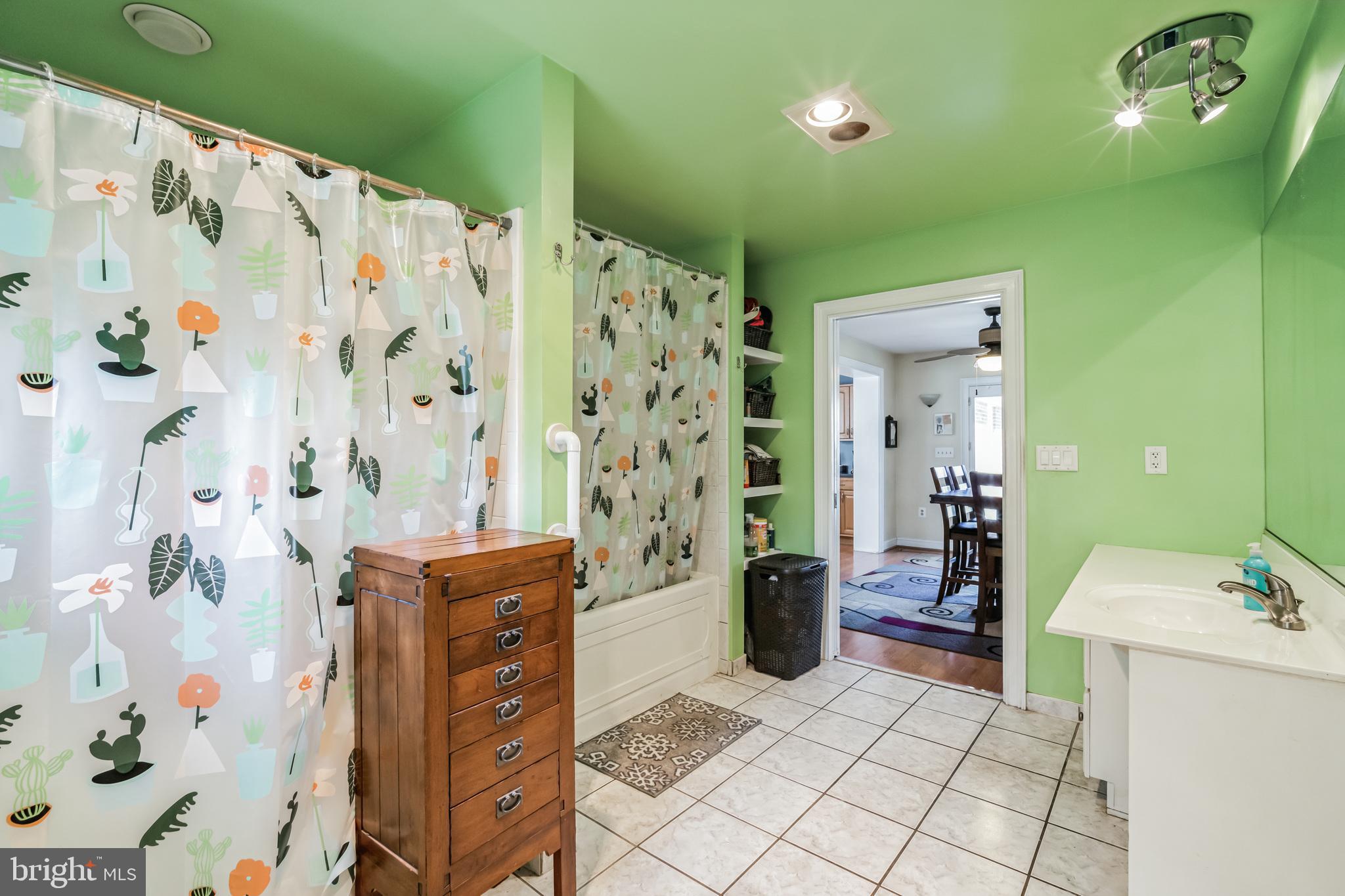 1443 Rhawn Street Philadelphia, PA 19111 - Photo 25 of 45 a bathroom with a sink a toilet and shower