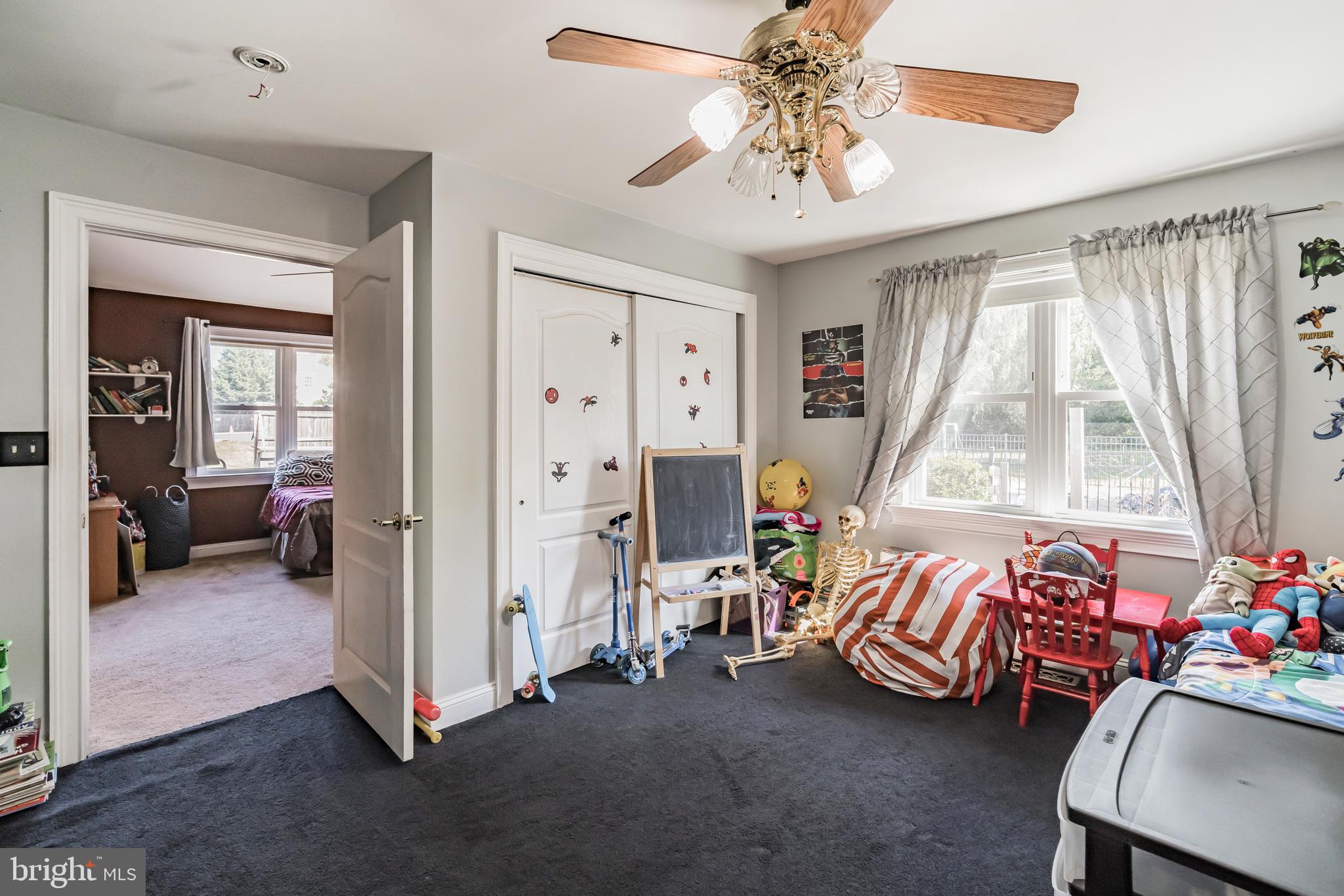 1443 Rhawn Street Philadelphia, PA 19111 - Photo 26 of 45 a bedroom with furniture and a large window