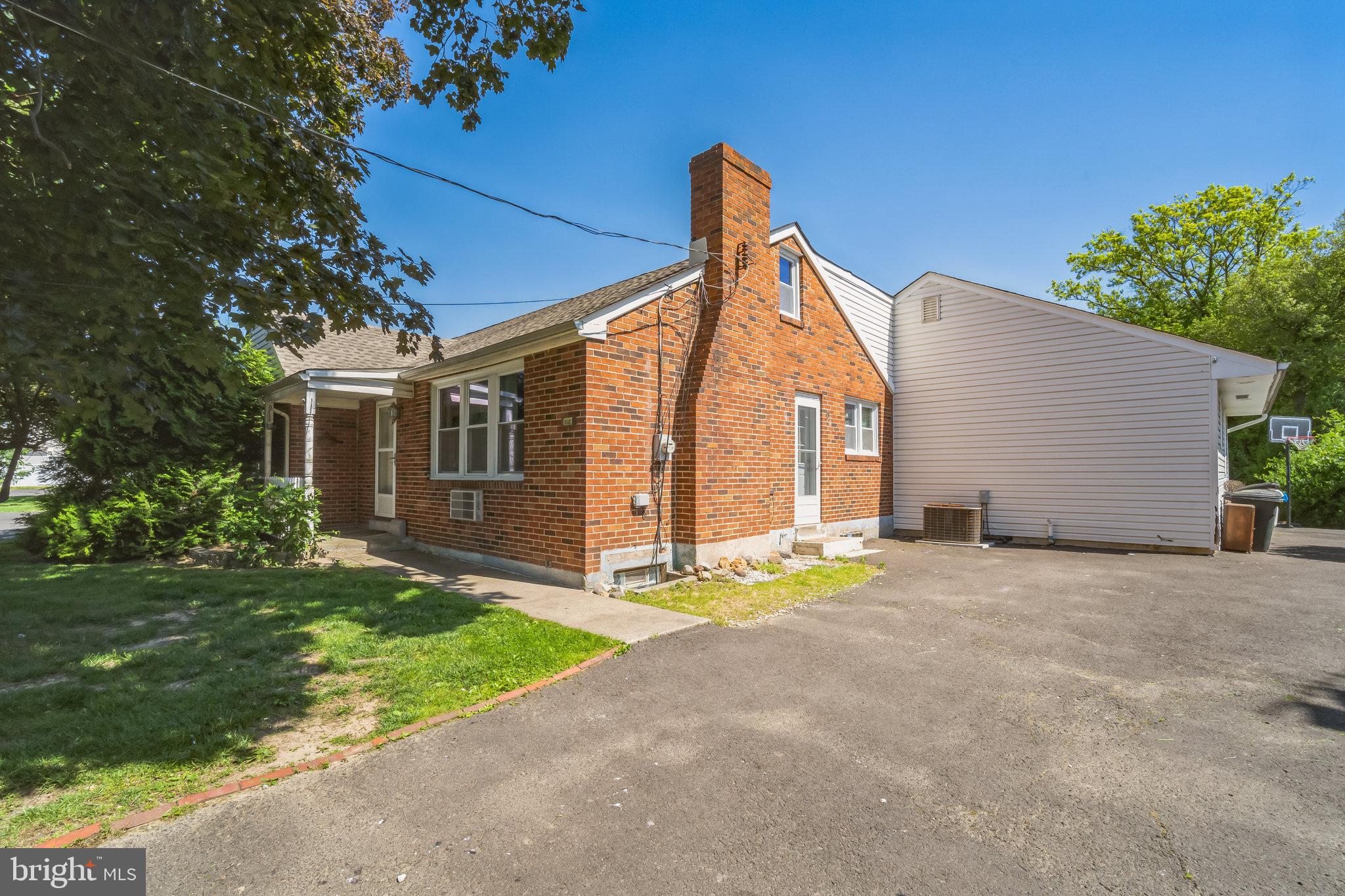 1443 Rhawn Street Philadelphia, PA 19111 - Photo 29 of 45 a view of a house with a yard and a garage