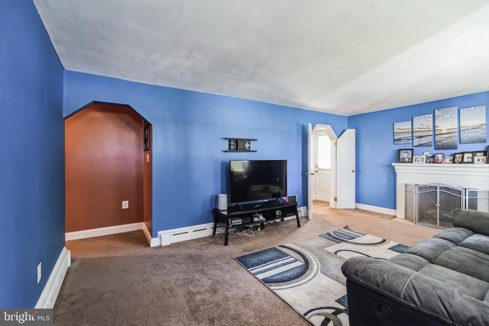 1443 Rhawn Street Philadelphia, PA 19111 - Photo 3 of 45 a living room with furniture and a flat screen tv