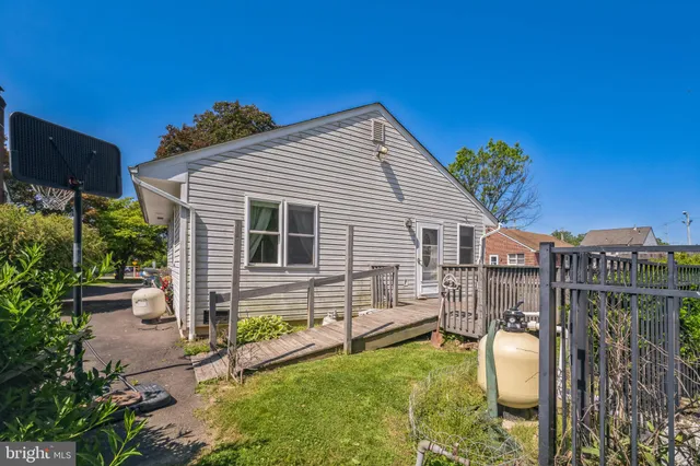 a view of a house with a backyard and a patio