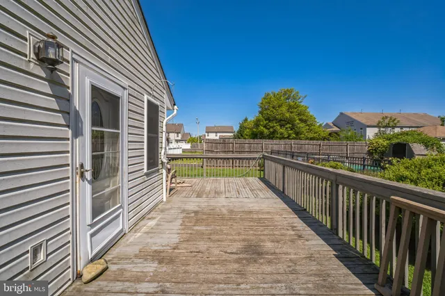 a view of balcony with wooden floor