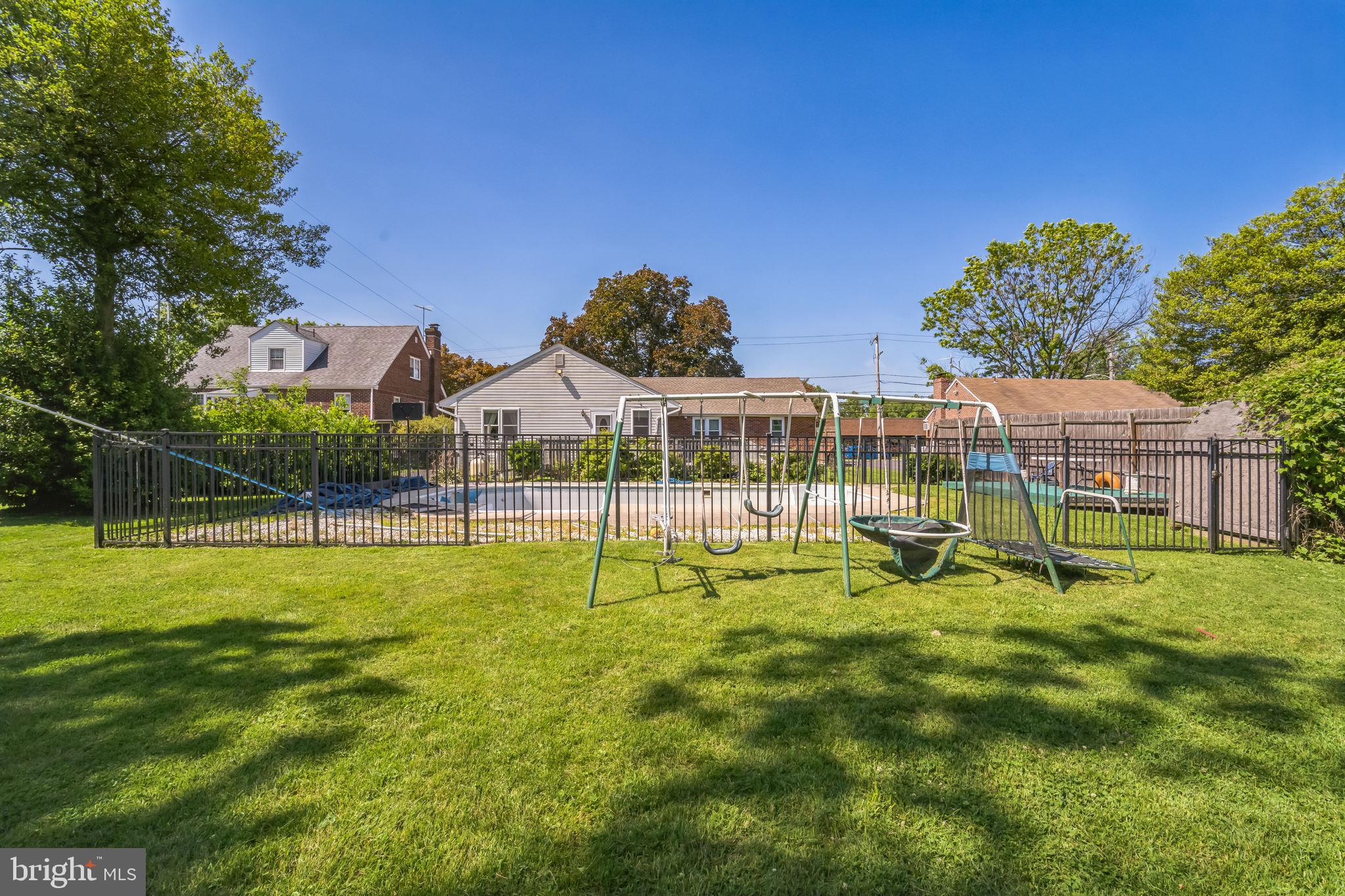 1443 Rhawn Street Philadelphia, PA 19111 - Photo 42 of 45 a view of a house with a backyard and a slide
