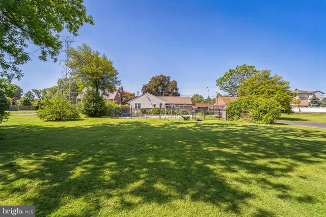 a garden with trees in the background