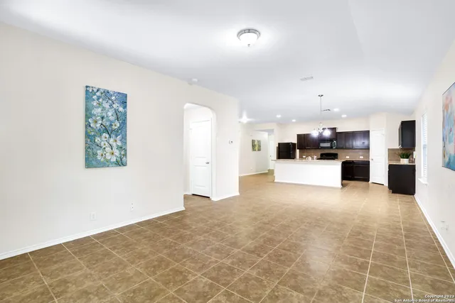 a view of a kitchen with furniture and a kitchen