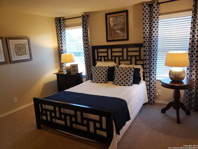 a bedroom with a bed and a table in it