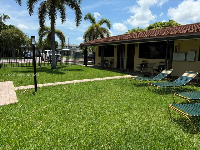 a view of a house with swimming pool and porch