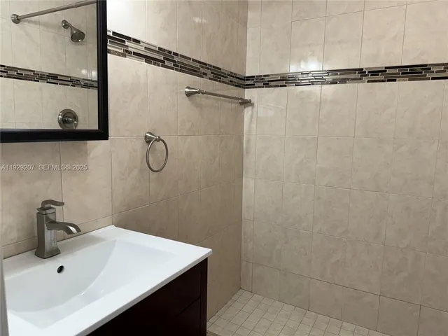 a bathroom with a sink and a shower