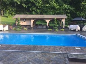 512 Central School Road Grindstone, PA 15442 - Photo 22 of 24 Stamped concrete surrounds the pool area!