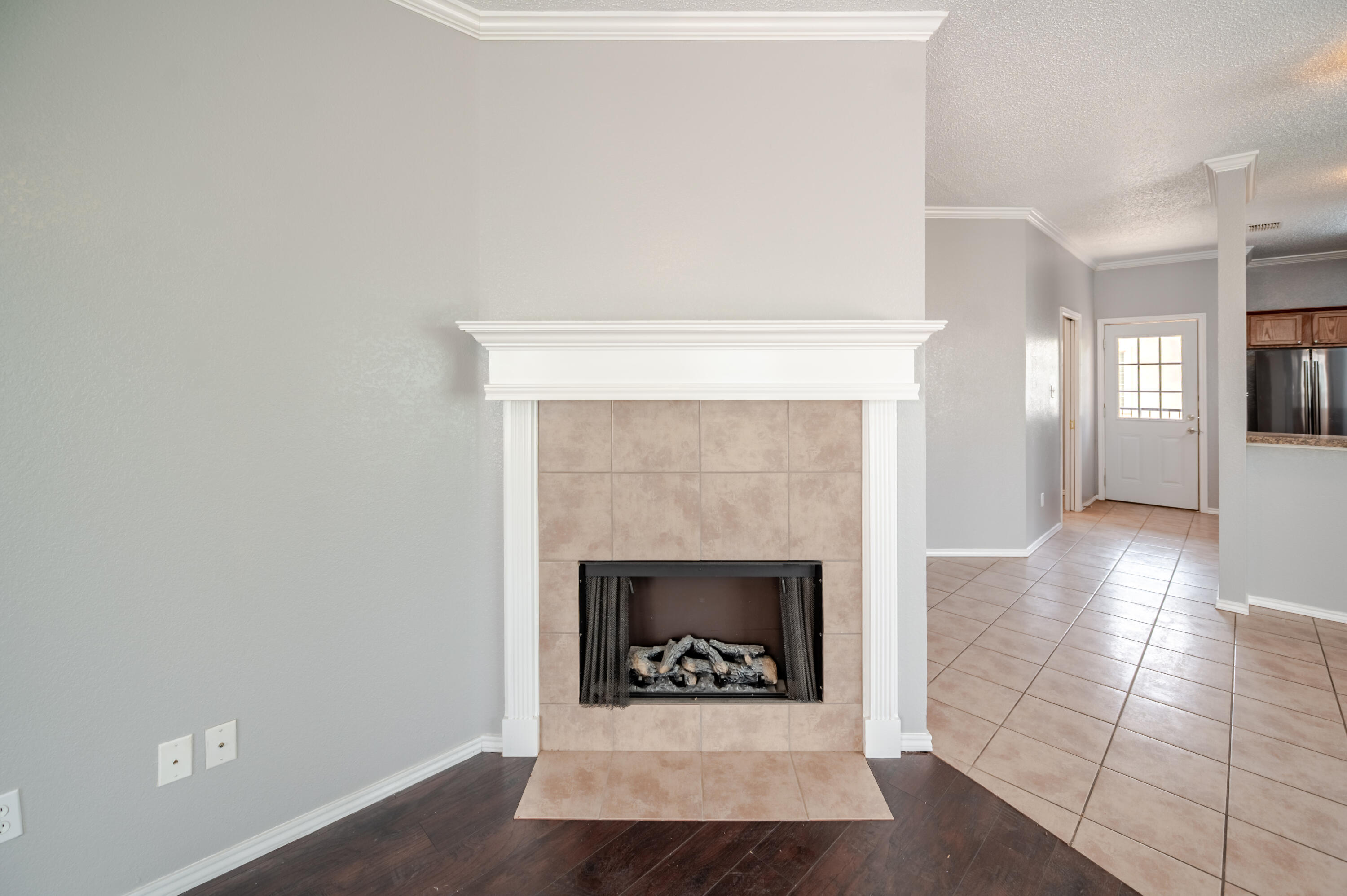 2111 Main Street, Unit 1 Lubbock, TX 79401 - Photo 11 of 36 a living room with a fireplace and a rug