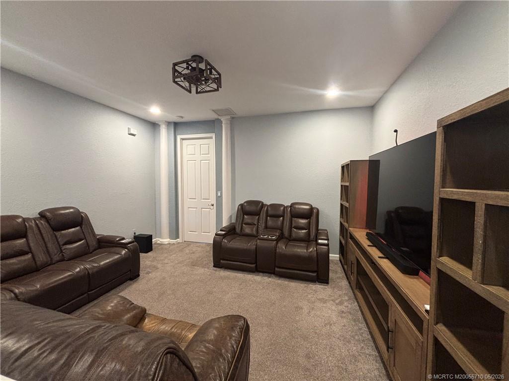 262 Southwest Walking Path, Unit 262 Stuart, FL 34997 - Photo 18 of 39 a living room with furniture and a flat screen tv