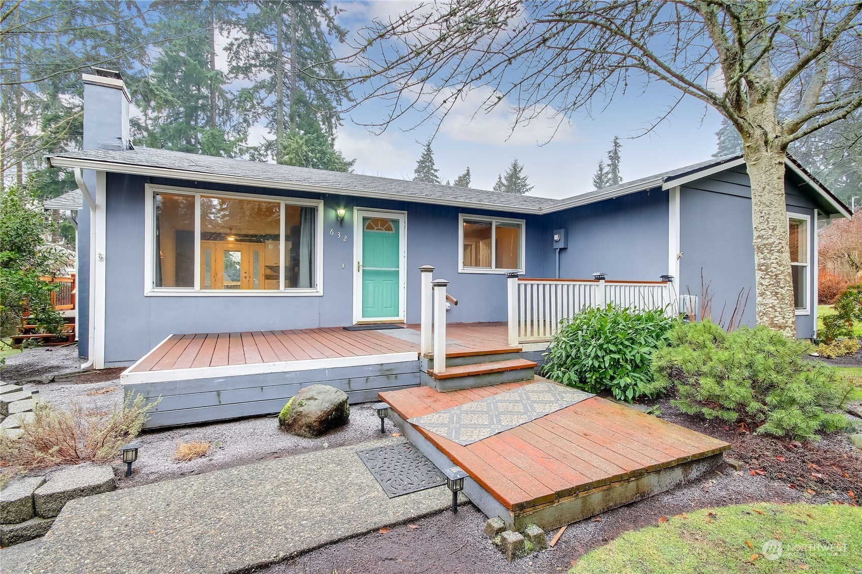 632 217th Street Southwest Bothell, WA 98021 - Photo 4 of 23 a wooden bench sitting in front of a house