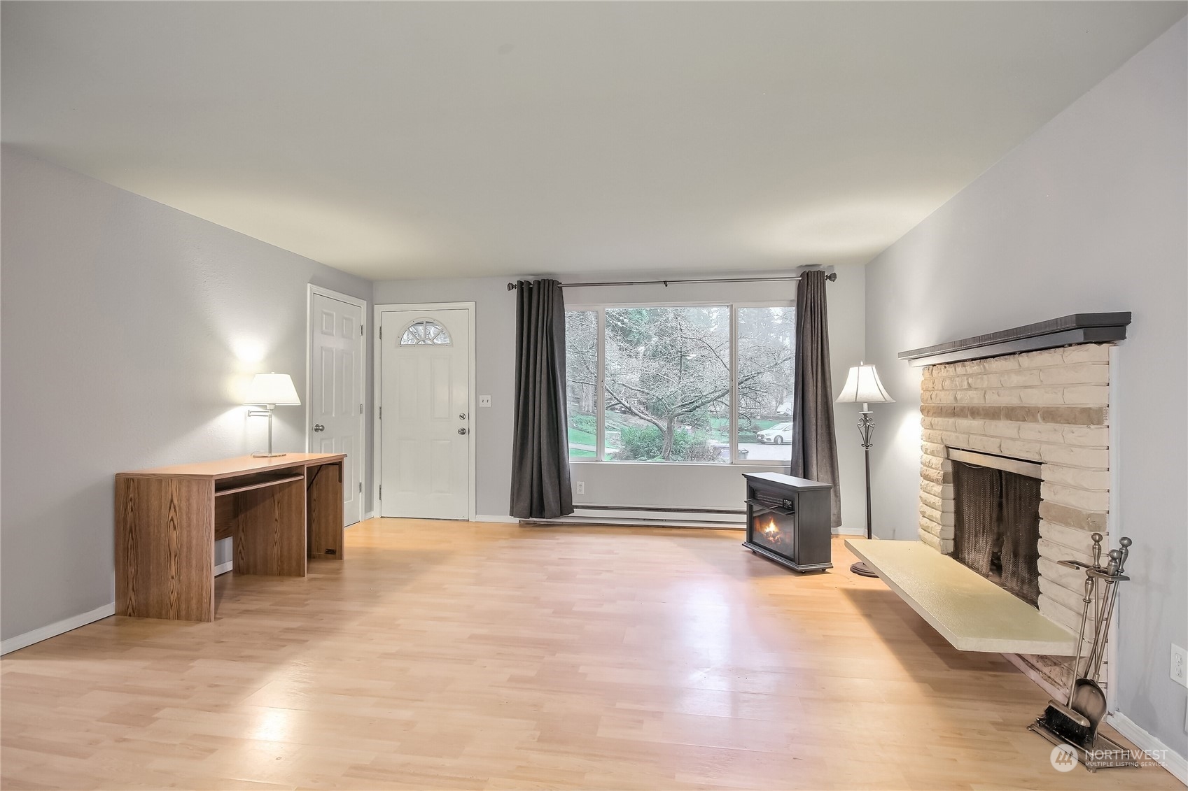 632 217th Street Southwest Bothell, WA 98021 - Photo 6 of 23 a view of an empty room with a fireplace and a window
