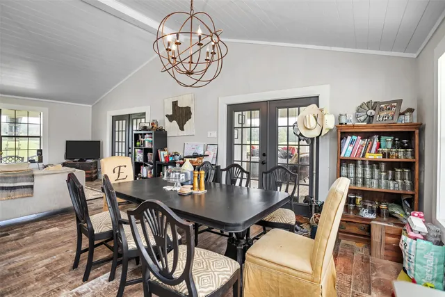 a aerial view of a house with a garden and lake view