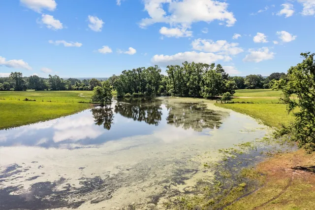 a view of an outdoor space pool patio and lake view