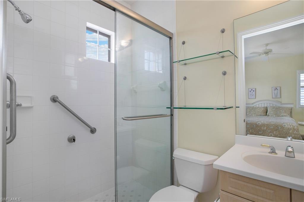758 Regency Reserve Circle, Unit 2103 Naples, FL 34119 - Photo 24 of 41 a bathroom with a sink toilet and shower