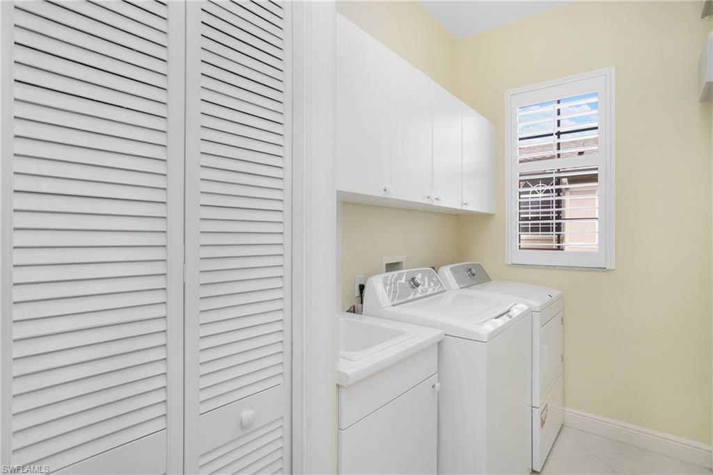 758 Regency Reserve Circle, Unit 2103 Naples, FL 34119 - Photo 25 of 41 a utility room with dryer and washer